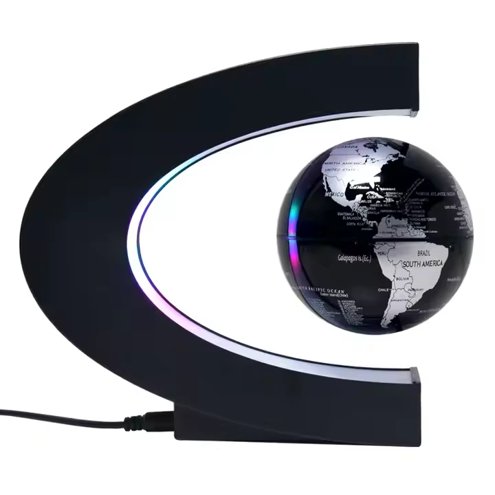 Black globe suspended inside its illuminated C-shaped magnetic frame