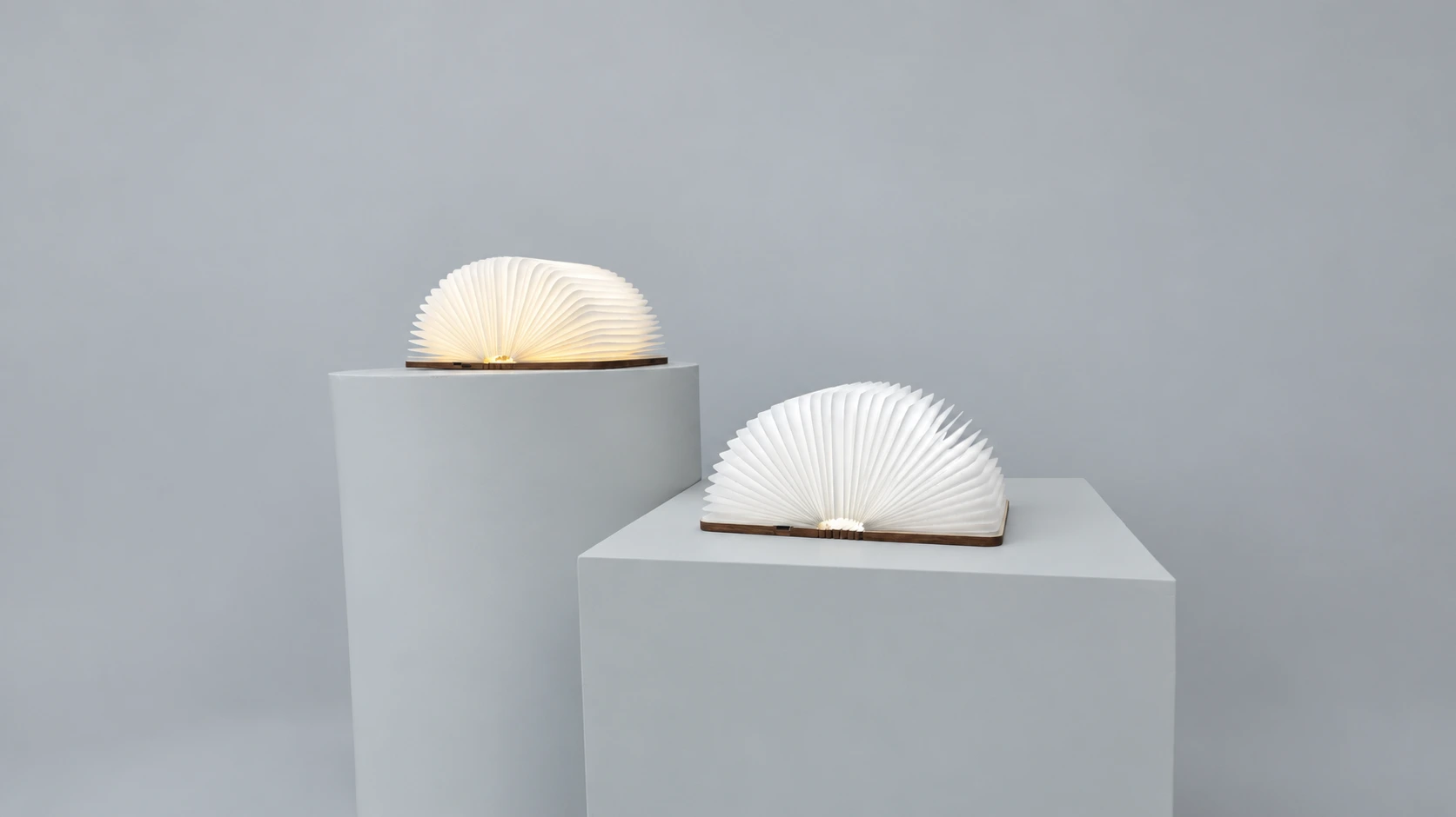 The same two wooden book lamps in daylight