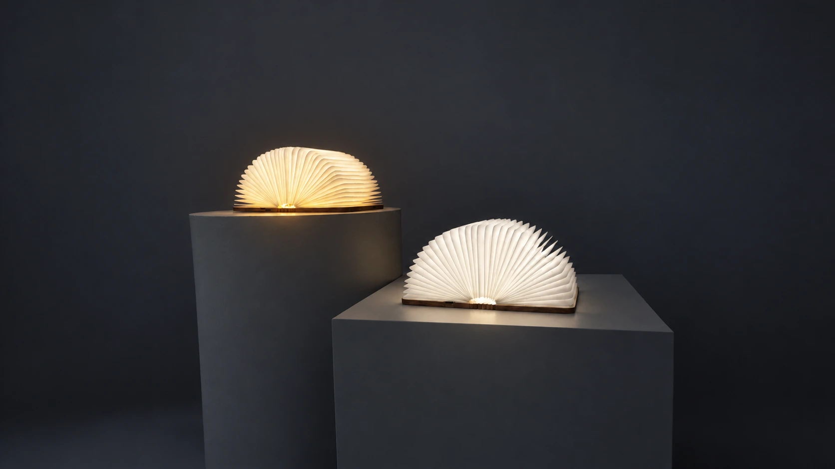 Two wooden book lamps with illuminated folded pages